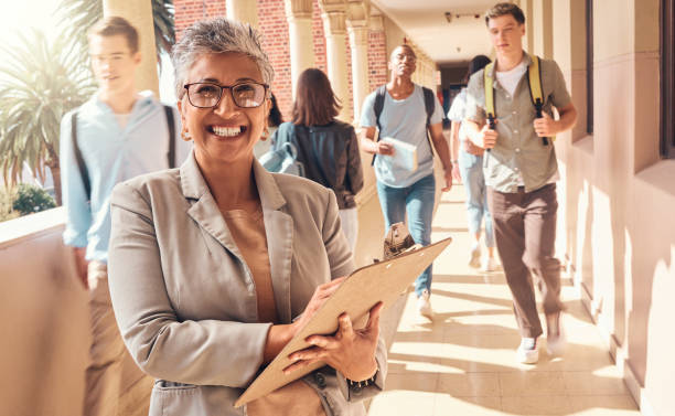 Administrator standing in hallway with students